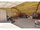 Spacious garage with concrete floor, storage, and large door at 4880 E Beehive Rd, San Tan Valley, AZ 85140