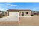 Detached garage with a metal roof, large garage door, and ample parking space at 4880 E Beehive Rd, San Tan Valley, AZ 85140