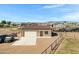 A charming metal garage with a roll-up door and adjacent space for outdoor equipment, situated on a sprawling lot at 4880 E Beehive Rd, San Tan Valley, AZ 85140