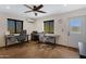 Bright office featuring two desks, ceiling fan, and natural light at 4880 E Beehive Rd, San Tan Valley, AZ 85140