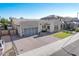 Modern home with two-car garage and artificial turf at 9503 W Jj Ranch Rd, Peoria, AZ 85383