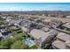 Aerial view of house with pool; solar panels visible at 9503 W Jj Ranch Rd, Peoria, AZ 85383