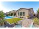 Large backyard with pool, sand area, and bocce ball court at 9503 W Jj Ranch Rd, Peoria, AZ 85383