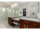 Luxurious bathroom with double vanities, a large shower, and marble finishes at 9503 W Jj Ranch Rd, Peoria, AZ 85383