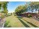 Landscaped common area with grassy lawn and mature trees at 9503 W Jj Ranch Rd, Peoria, AZ 85383