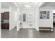 Bright and airy entryway with tile floors and modern light fixture at 9503 W Jj Ranch Rd, Peoria, AZ 85383