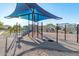 Modern playground with shade sails and climbing structures at 9503 W Jj Ranch Rd, Peoria, AZ 85383