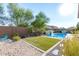 Inviting pool and spa with artificial turf and sand play area at 9503 W Jj Ranch Rd, Peoria, AZ 85383