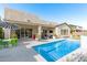 Gorgeous pool and patio with seating area and a stylish umbrella at 9503 W Jj Ranch Rd, Peoria, AZ 85383