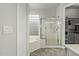 Spa-like bathroom with a glass-enclosed shower and separate tub with tile surround at 3122 E Windmere Dr, Phoenix, AZ 85048
