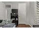 Bedroom with a TV, wood floors and neutral paint, offering a cozy and comfortable space at 3122 E Windmere Dr, Phoenix, AZ 85048