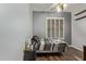 Bedroom showcasing wood floors, a ceiling fan, window shutters and open shelves at 3122 E Windmere Dr, Phoenix, AZ 85048