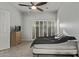 Cozy bedroom with soft carpet, plantation shutters, and ample natural light at 3122 E Windmere Dr, Phoenix, AZ 85048