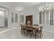 Dining room showcasing a wood table set and bright, shuttered windows, creating a welcoming space at 3122 E Windmere Dr, Phoenix, AZ 85048