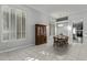 Bright dining room featuring white shutters, classic wood furniture and tile flooring at 3122 E Windmere Dr, Phoenix, AZ 85048