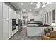 Bright kitchen featuring stainless steel appliances, white cabinetry, and dark countertops at 3122 E Windmere Dr, Phoenix, AZ 85048