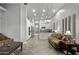 Open-concept living room flows into a modern kitchen with granite countertops and stainless steel appliances at 3122 E Windmere Dr, Phoenix, AZ 85048