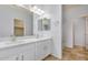 Clean bathroom with double vanity and white cabinets at 42356 W Balsa Dr, Maricopa, AZ 85138