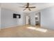 Bedroom with tile floors, ceiling fan and ensuite bathroom at 42356 W Balsa Dr, Maricopa, AZ 85138