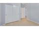 Bedroom with double door closet and tile floor at 42356 W Balsa Dr, Maricopa, AZ 85138