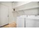 Laundry room with washer, dryer and storage at 42356 W Balsa Dr, Maricopa, AZ 85138