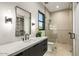 Modern bathroom featuring a stylish vanity with a sleek countertop and a glass-enclosed shower at 40575 N 109Th Pl, Scottsdale, AZ 85262