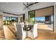 Modern dining room with elegant chandelier and open floor plan at 40575 N 109Th Pl, Scottsdale, AZ 85262