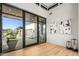 Bright foyer featuring light wood flooring, modern light fixtures and views of the outdoor patio at 40575 N 109Th Pl, Scottsdale, AZ 85262