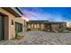 Beautiful modern home featuring a welcoming entrance, a spacious paved driveway, and desert landscaping for a stylish curb appeal at 40575 N 109Th Pl, Scottsdale, AZ 85262
