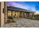Inviting front entrance with modern design, stone accents, desert landscaping, and a paved driveway for curb appeal at 40575 N 109Th Pl, Scottsdale, AZ 85262