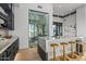 Island kitchen with a glass-enclosed wine cellar at 40575 N 109Th Pl, Scottsdale, AZ 85262