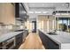 Modern kitchen featuring stainless steel appliances and a large island with a sink at 40575 N 109Th Pl, Scottsdale, AZ 85262