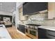 Gourmet kitchen boasts stainless steel appliances and a marble backsplash at 40575 N 109Th Pl, Scottsdale, AZ 85262