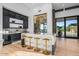 Island kitchen with a glass-enclosed wine cellar at 40575 N 109Th Pl, Scottsdale, AZ 85262