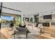 Large open floor plan living area with modern decor and an easy transition to the kitchen at 40575 N 109Th Pl, Scottsdale, AZ 85262