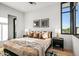 Cozy bedroom features modern decor, carpet, and large window with mountain views, a great space to unwind at 40575 N 109Th Pl, Scottsdale, AZ 85262