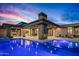 Expansive pool area with an outdoor kitchen, dining, and lounge spaces, perfect for entertaining and enjoying the view at 40575 N 109Th Pl, Scottsdale, AZ 85262