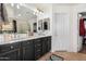 Bathroom with double vanity, dark cabinets, and gold accents at 62 W Elmwood Pl, Chandler, AZ 85248