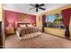 King-size bedroom with leopard print bedding and a ceiling fan at 62 W Elmwood Pl, Chandler, AZ 85248