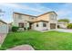 Two-story house with a brown door and well-manicured lawn at 62 W Elmwood Pl, Chandler, AZ 85248