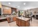 Spacious kitchen featuring an island, stainless steel appliances, and ample cabinetry at 62 W Elmwood Pl, Chandler, AZ 85248