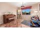 Music room with piano, seating area, and decorative accents at 62 W Elmwood Pl, Chandler, AZ 85248