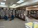 Community library with bookshelves, seating area and game table at 7920 E Camelback Rd # 206, Scottsdale, AZ 85251