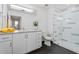 Modern bathroom featuring double vanity sinks, a glass shower, and sleek black tile at 1130 N 2Nd St # 409, Phoenix, AZ 85004