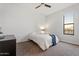 Bright bedroom featuring a ceiling fan, neutral carpet, and a serene window view at 1130 N 2Nd St # 409, Phoenix, AZ 85004