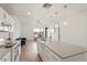 Modern kitchen featuring an island with pendant lights, sleek white cabinetry, and stainless steel appliances at 1130 N 2Nd St # 409, Phoenix, AZ 85004