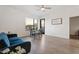 Bright living area with a blue sofa, dining table, and a window offering views of the cityscape at 1130 N 2Nd St # 409, Phoenix, AZ 85004