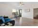 Cozy living room area featuring a blue couch, a dining table, and a window showcasing city views at 1130 N 2Nd St # 409, Phoenix, AZ 85004