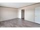 Neutral bedroom featuring modern wood-look floors and natural light at 52089 W Organ Pipe Rd, Maricopa, AZ 85139