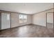 Beautiful living room features vinyl flooring, neutral walls, and natural light at 52089 W Organ Pipe Rd, Maricopa, AZ 85139